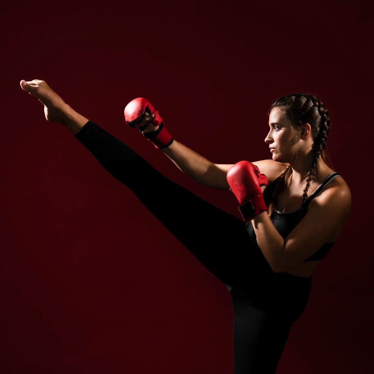 Woman practicing kicks