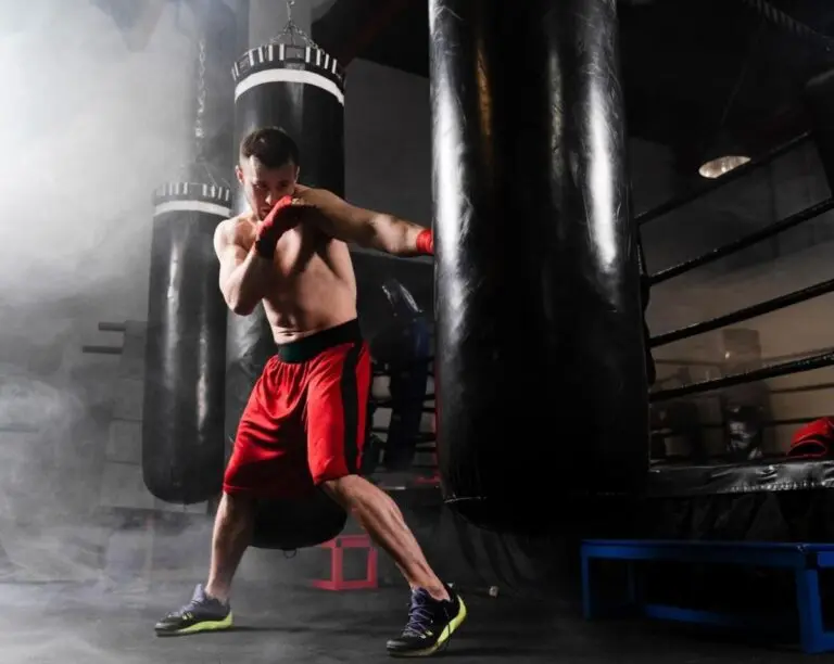 adult male practicing punches in a boxing class